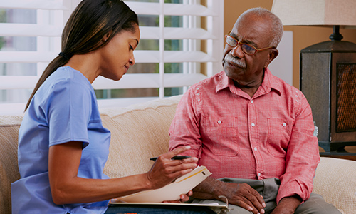 Man talking with a caregiver